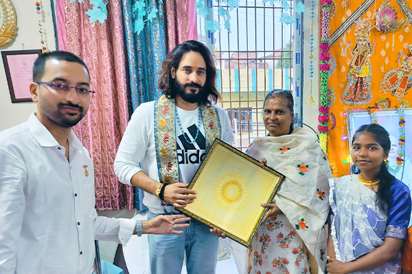 Actor Siddharth Arora at Divine Sanskarshala, engaging with students and attendees during a cultural and educational program.